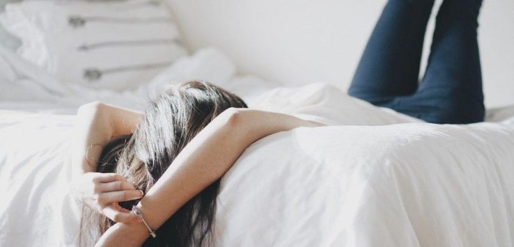 A girl laying on a bed