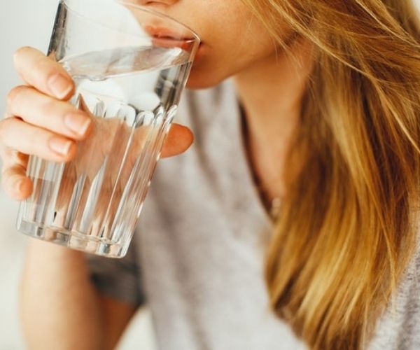 Woman drinking a glass of water