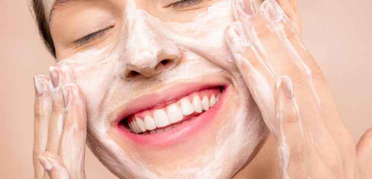 Woman washing her face