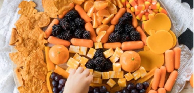 Candy, crackers, and fruits shaped into Jack-O-Lantern